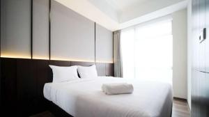 Tidy and Spacious 2BR at Grand Sungkono Lagoon Apartment By Travelio