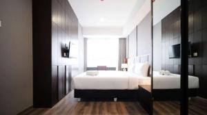 Tidy and Spacious 2BR at Grand Sungkono Lagoon Apartment By Travelio