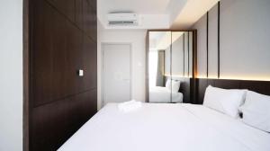 Tidy and Spacious 2BR at Grand Sungkono Lagoon Apartment By Travelio