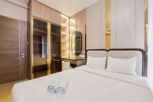 Scenic and Restful 2BR Sky House BSD Apartment By Travelio