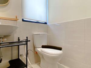 Clean and Homey 2BR at Meikarta Apartment By Travelio