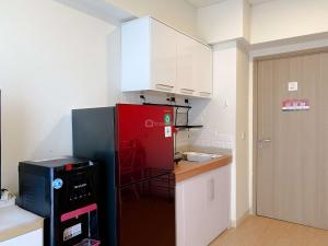 Clean and Homey 2BR at Meikarta Apartment By Travelio