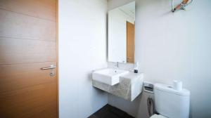 Homey 1BR with Extra Room Apartment at Aryaduta Residence Surabaya By Travelio