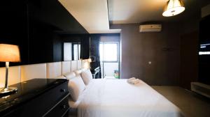 Spacious and Comfy 2BR Apartment at Aryaduta Residence Surabaya By Travelio