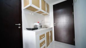 New Studio Apartment with Strategic Location at Suncity Residence By Travelio