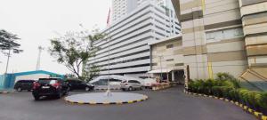 Homey Studio at Orchard Supermall Mansion Apartment By Travelio