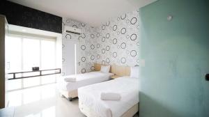 Cozy Studio The Square Surabaya Apartment By Travelio