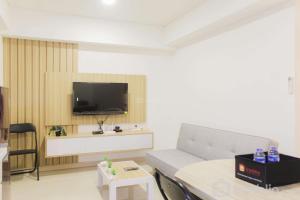Brand New and Homey 2BR Meikarta Apartment By Travelio