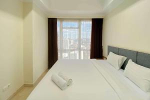 Spacious and Combined 2BR at Menteng Park Apartment By Travelio