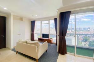 Spacious and Combined 2BR at Menteng Park Apartment By Travelio