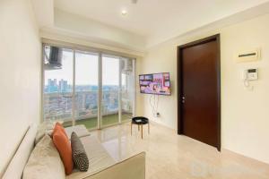Spacious and Comfort Living 2BR at Menteng Park Apartment By Travelio