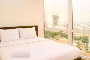 Stunning and Comfortable 2BR at Menteng Park Apartment By Travelio