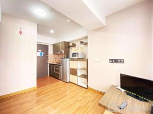 Homey 1BR at Jarrdin Cihampelas Apartment By Travelio