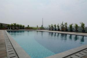 Minimalist Studio at Tree Park City BSD Apartment By Travelio