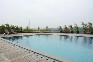 Minimalist Studio at Tree Park City BSD Apartment By Travelio