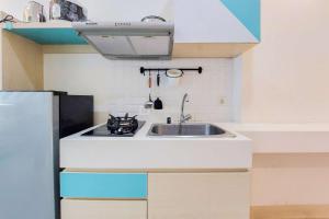 Minimalist Studio at Tree Park City BSD Apartment By Travelio