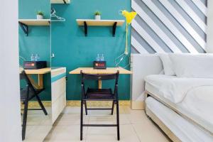 Minimalist Studio at Tree Park City BSD Apartment By Travelio