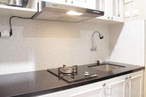 Cozy Studio Apartment at Grand Asia Afrika By Travelio