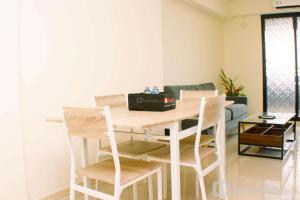 Comfort and Well Design 2BR with Working Room at Meikarta Apartment By Travelio