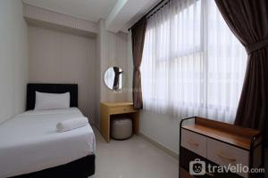 Elegant and Comfy 3BR Transpark Cibubur Apartment By Travelio