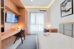 Minimalist Studio at Sky House Alam Sutera Apartment By Travelio