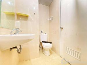 Cozy Living 1BR Apartment at Parahyangan Residence By Travelio