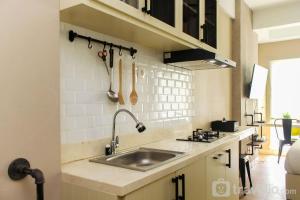 New and Cozy Studio at Patraland Urbano Apartment By Travelio