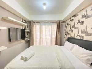 Homey Studio Furnished at Grand Asia Afrika Apartment By Travelio