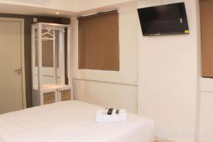 Minimalist Design Studio at Meikarta Apartment By Travelio