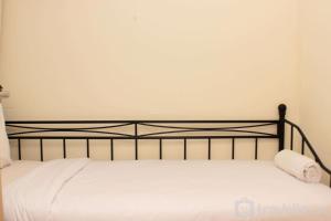 Warm and Cozy Living 3BR at Meikarta Apartment By Travelio