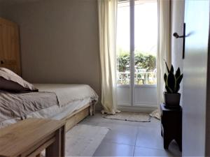 Appartements Appartement avec jardinet et terrasse : photos des chambres