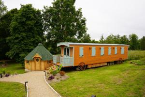 Campings Roulottes et son kota grill sauna : photos des chambres