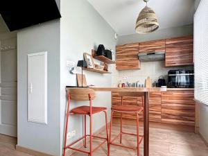 Appartements Charmant studio avec parking : photos des chambres