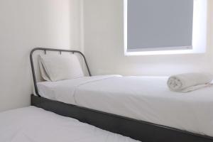 Modern Look 2BR at Apartment Parahyangan Residence By Travelio