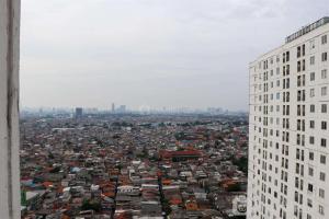 Cozy Stay 3BR Bassura City Apartment near Mall By Travelio