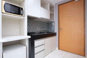 Good Location and Cozy Studio Margonda Residence 2 Apartment By Travelio