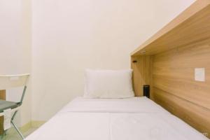 Minimalist and Best Deal 2BR Green Pramuka City Apartment By Travelio