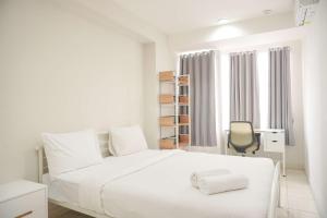 Homey and Minimalist 1BR Cinere Bellevue Suites Apartment By Travelio