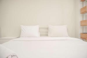 Homey and Minimalist 1BR Cinere Bellevue Suites Apartment By Travelio