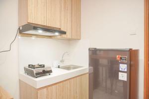 Homey and Minimalist 1BR Cinere Bellevue Suites Apartment By Travelio