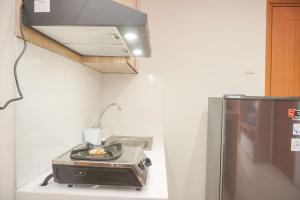 Homey and Minimalist 1BR Cinere Bellevue Suites Apartment By Travelio