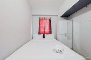 Homey and Simply 2BR Apartment Aeropolis Residence By Travelio