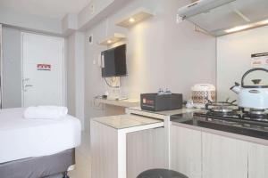 Well Designed and Cozy Studio at Bassura City Apartment By Travelio