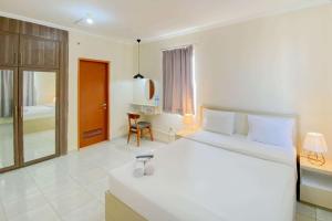 Good and Cozy Studio (Free IPL & Utilities) Grand Palace Kemayoran Apartment By Travelio