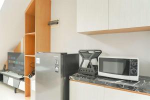 Studio Loft No Kitchen Mezzanine at Kubikahomy Apartment By Travelio