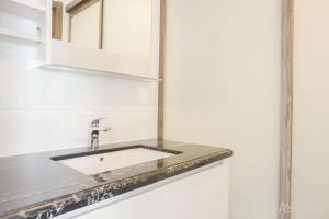 Fully Furnished with Pleasure 2BR at Sky House BSD Apartment By Travelio