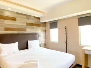 Best Deal and Homey 1BR Apartment Grand Sentraland Karawang By Travelio - Badami