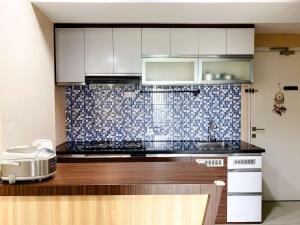 Best Deal and Homey 1BR Apartment Grand Sentraland Karawang By Travelio