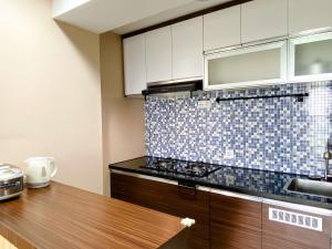 Best Deal and Homey 1BR Apartment Grand Sentraland Karawang By Travelio