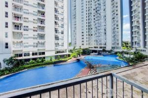 Warm and Homey Studio Room Casa de Parco Apartment By Travelio